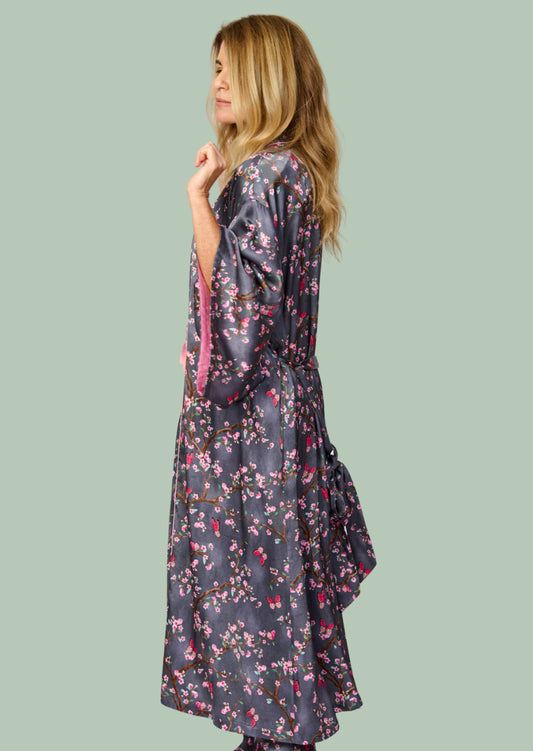 Pretty cherry blossom floral print silky feel kimono robe - side view - arms folded - shown with matching pyjama pants