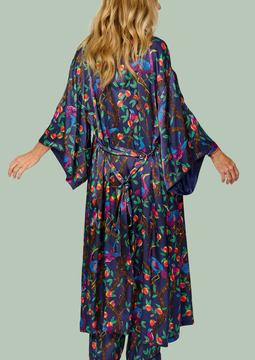 Brightly colour tropical bird and foliage print - silky feel kimono robe - back view - arms out - shown with matching pyjama pants